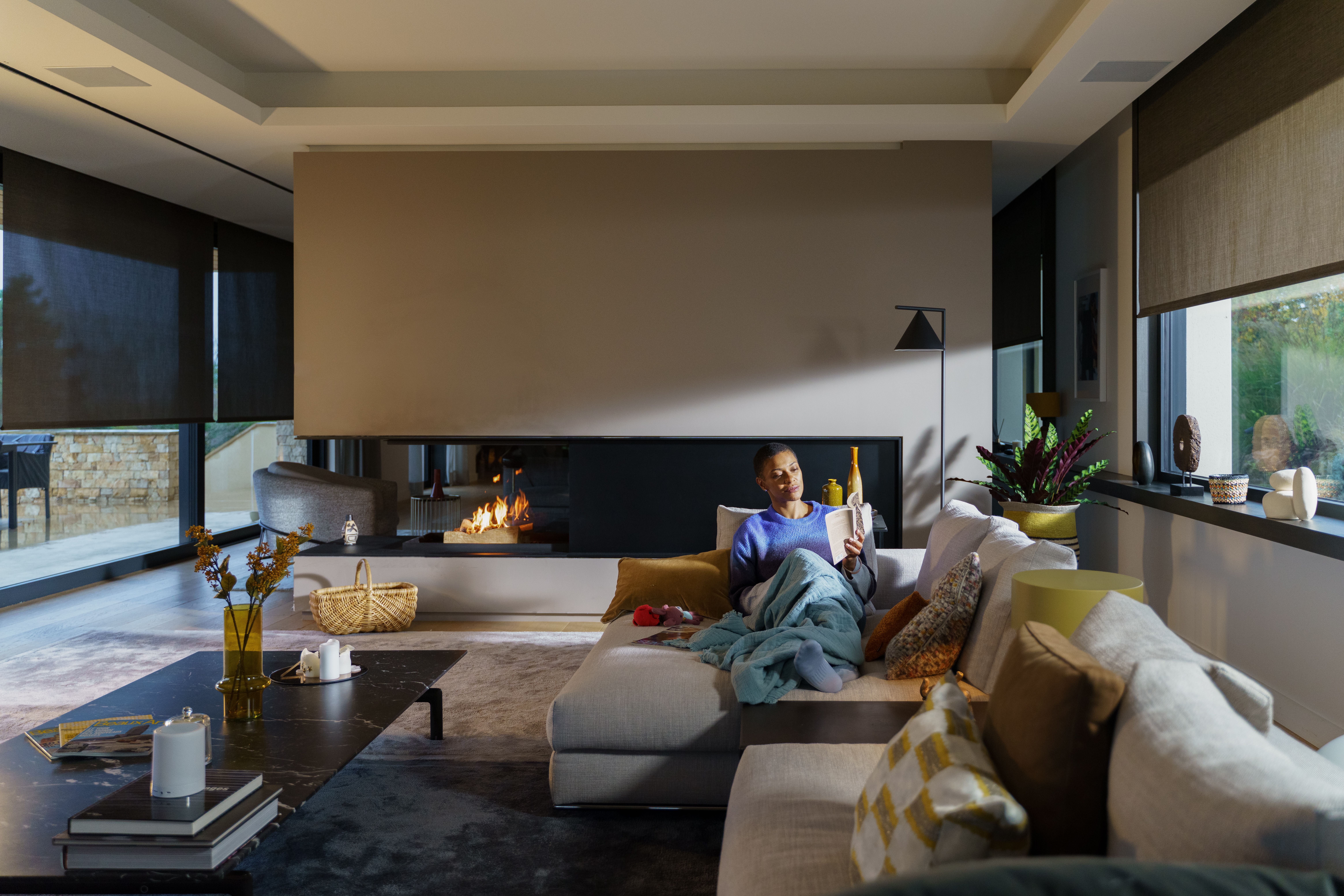 Lady reading in her sofa